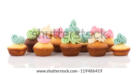 many cupcakes with colorful butter cream isolated over white background