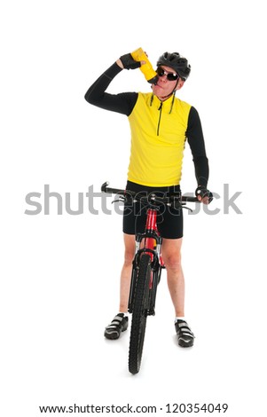 Active mountain biker drinking water in studio isolated over white background