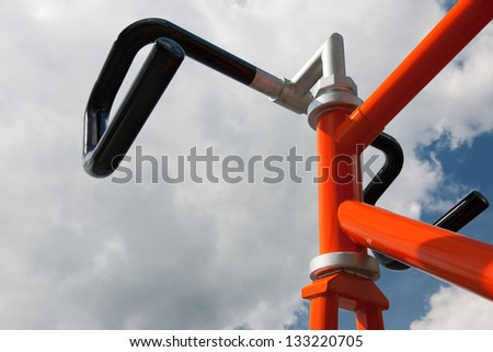 Steer of orange racing bike