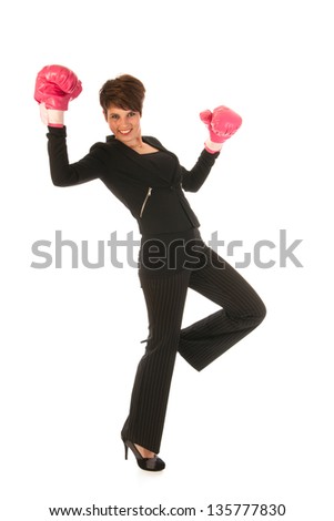 Young woman is enjoying a boxing fight in business isolated over white background