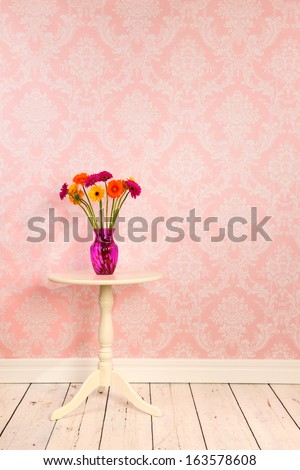 Vintage Wall, Wooden Floor And Plinth With White Table And Vase With Flowers