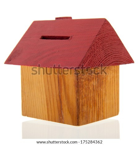 wooden house as piggy bank