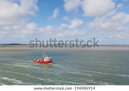 Red Dutch fishing trawler at wadden sea