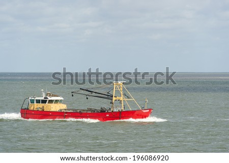 Red Dutch fishing trawler at wadden sea