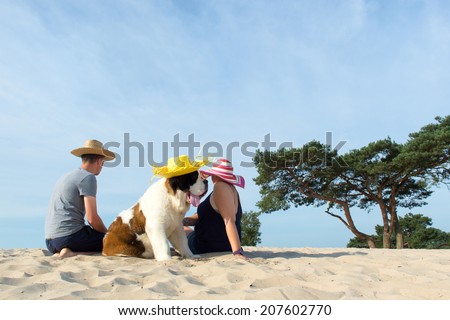 Family with their big dog at the beach