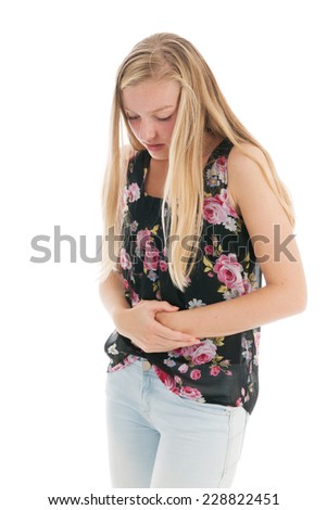 Teen girl with belly ache isolated over white background