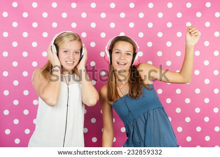 Girlfriends with head phones loving disco music