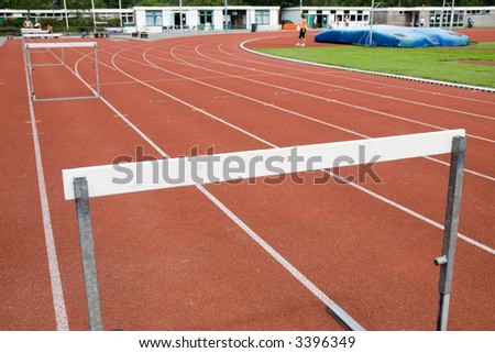 row of hurdles and tracks for a hurdle-race