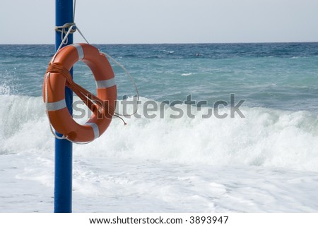 Life-bouy on the beach to save lifes