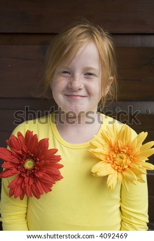 funny girl with big colored flowers