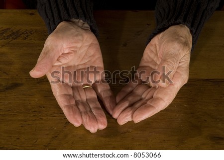 stock photo open old hands with weddingring