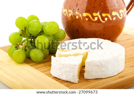 French camembert with white grapes and wine carafe