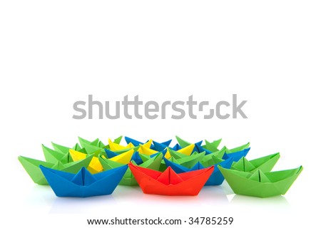 colorful folder paper boats isolated over white