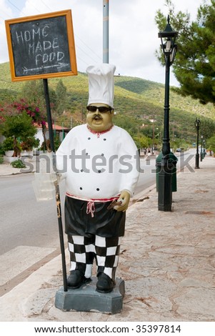 stock photo Big cook is giving the direction of home made food