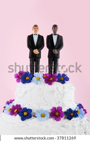 wedding cakes with flowers on top. stock photo : Wedding cake with flowers and homo couple on top