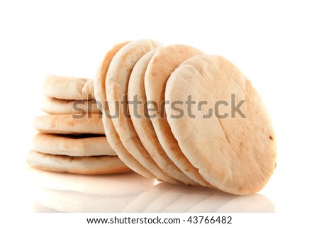 Pita flat bread stacked and isolated over white