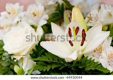White flowers as roses and lily for the funeral