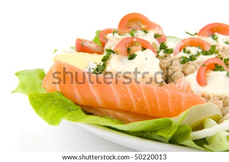 Fresh salmon salad with fish and vegetables