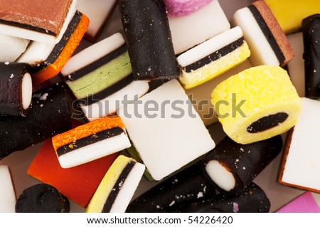 All sort licorice candy sweets isolated over white