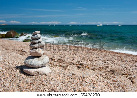 Landscape beach with stacked stones in balance