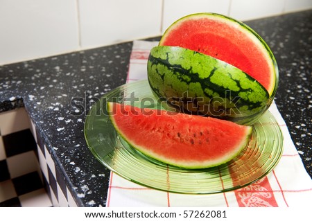 water melon at the dresser in the kitchen
