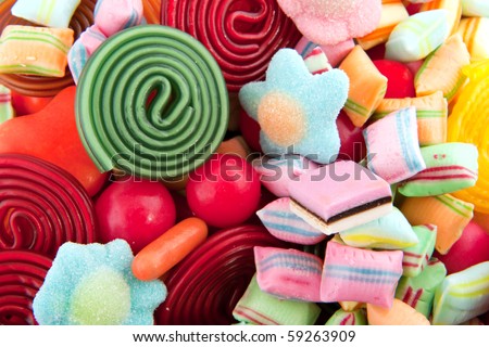 Many colorful candy sweets with rolls balls and pillows
