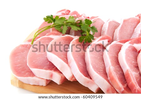 Many fresh pork chops or cutlets with parsley