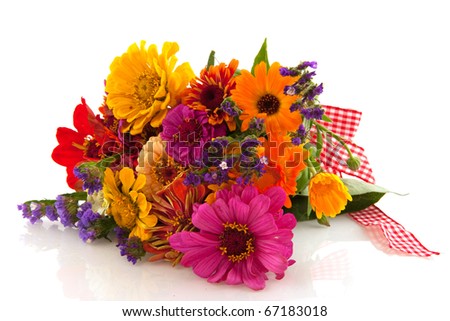 Various colorful summer flowers in bouquet with ribbon