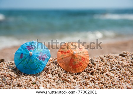 Colorful Chinese paper parasols for shade at the sunny beach