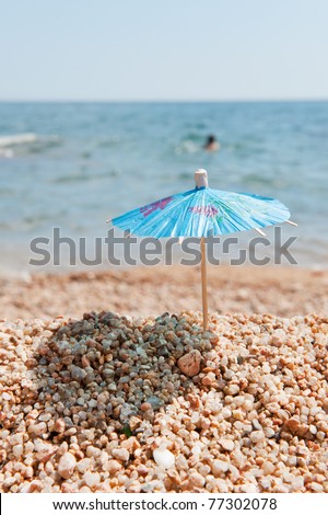 Blue Chinese paper parasol for shade at the sunny beach