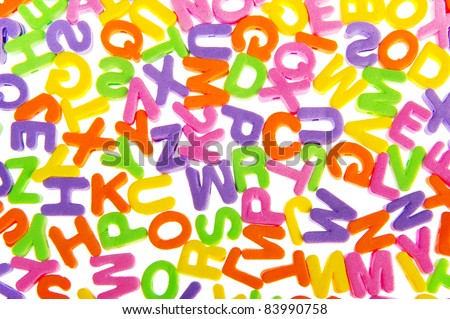 Colorful letter chaos with foam on white background