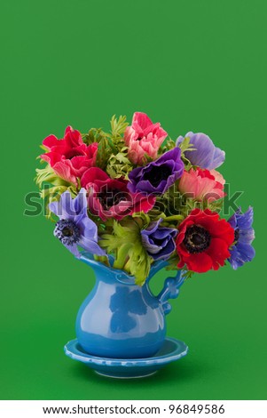 Little vase with colorful bouquet Anemones