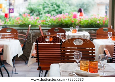 Colorful terrace outdoor with tables and chairs