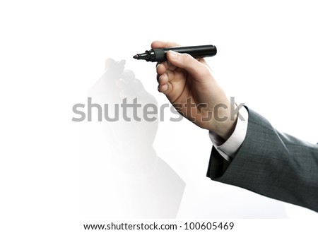 Businessman hand drawing in a whiteboard
