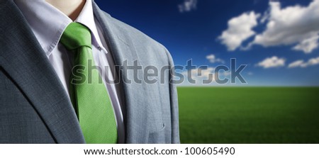 environment concept: Close up of classic business attire with green   tie and elegant blazer.