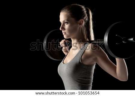 young woman weight training young woman weight training