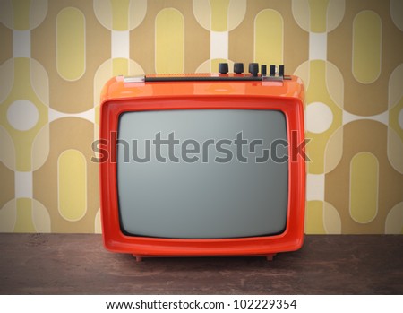 Old TV on vintage background