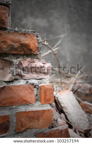 Bricks and mortar with broken walls