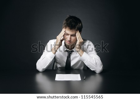 Young businessman has the headache