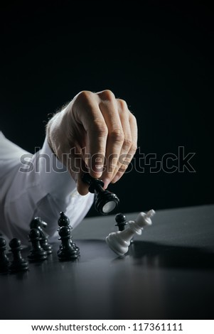 Chess player making his checkmate move.