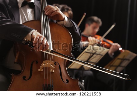 Symphony Concert, A Man Playing The Cello, Hand Close Up