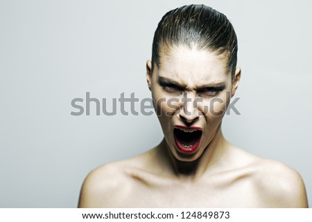Beautiful woman shouting angry, copy space