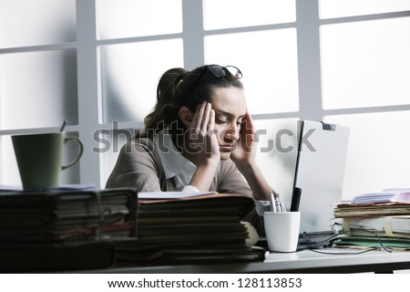 Exhausted Businesswoman Having A Headache.