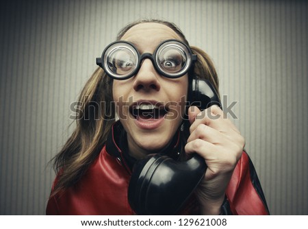 funny nerd humor woman talking retro vintage black telephone on vintage wallpaper