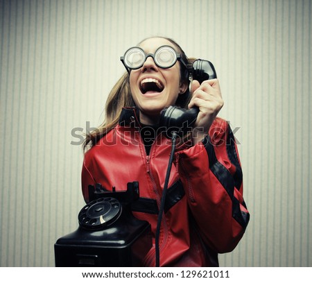 funny nerd humor woman talking retro vintage black telephone on vintage wallpaper