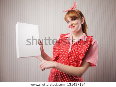 Housewife with a blank package of laundry detergent in her hand. Add your logo in it's place