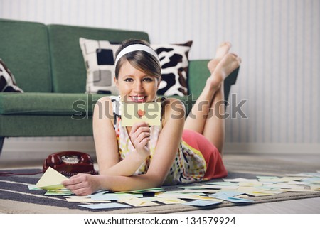 Attractive girl with Valentine card or loveletter