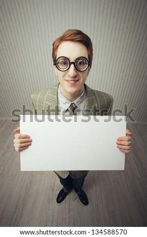 Business man nerd holds a blank sign, ready for your text, old style image