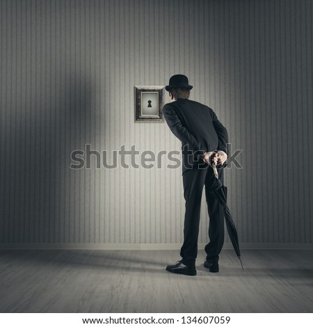 Businessman Looking Through Keyhole