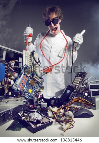 Crazy computer technician is trying to repair a computer